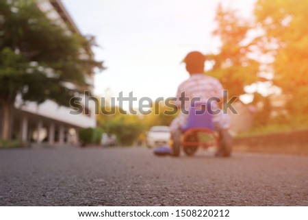 Boy, 6 years old Cycling and exercising during the evening hours., blurred picture