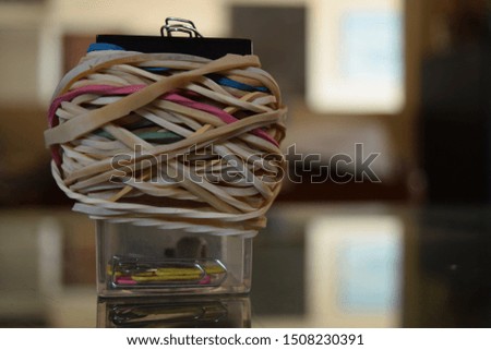 close up of rubber bands and clips at the office