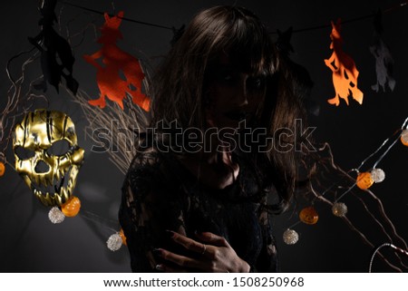 halloween background with witch and pumpkin garland hanging, Ghost Zombie girl with fresh Wound on face black hair dress as scary and want to revenge kill all of Haunted places