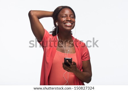 Young African American woman on iPod, horizontal Royalty-Free Stock Photo #150827324