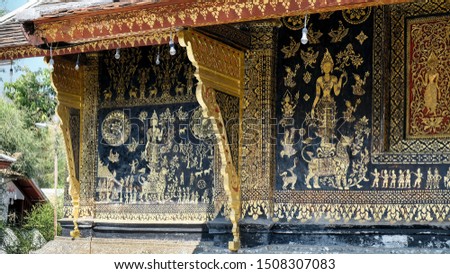 Golden decorative picture of Wat Xieng Thong World Heritage site in Luang Prabang Laos