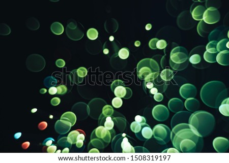 Beautiful optical abstract color bokeh in the darkness  background.