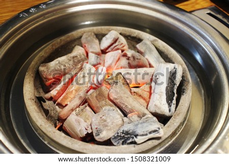 
Grilled charcoal in a bowl