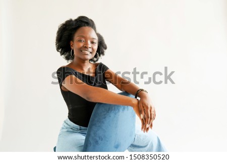 Portrait of young African American woman isolated over white background