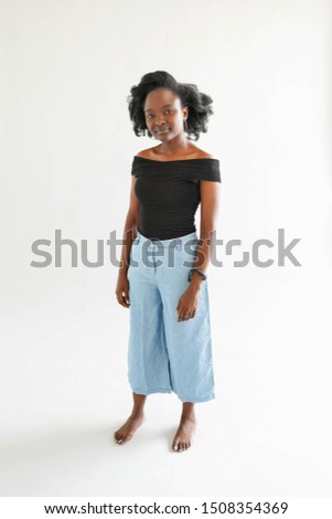 Portrait of young African American woman isolated over white background