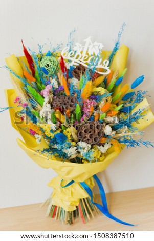Multicolored bouquet of dried flowers: green, blue, orange, yellow, red, white. Lotus, cotton, wheat flowers, rattan balls, lagoon, lavender, statice, munn. Translation: September 1