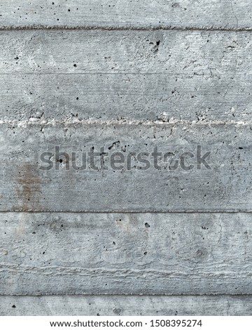 grey concrete wall closeup with wooden planks pattern imprint, seamless background