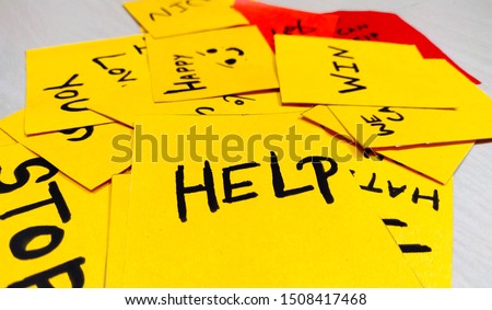 Yellow short note paper with written words help