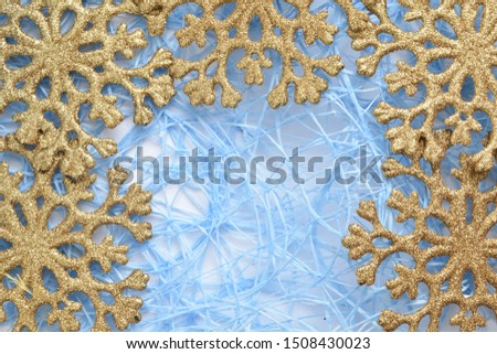 golden snowflakes. Christmas background. New Year's toys.