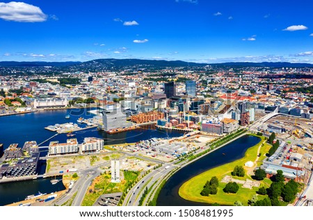 Oslo, Norway. Aerial view of Sentrum area of Oslo, Norway, with Barcode buildings and the river Akerselva. Construction site with blue sky during a sunny summer day Royalty-Free Stock Photo #1508481995