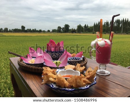 Eating thai food Beside the rice field, Take a picture with a mobile phone (Iphone 6)