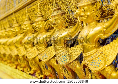 Set of many demon guardian statue in the landmark historic famous temple - Temple of the Emerald Buddha or WAT PHRA KAEW call in Thai in Bangkok, Thailand. Shallow depth of field focus.