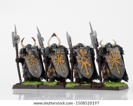 Chaos Knight Army. Toy knights for Fantasy gaming. Armed warriors. Hand painted army figurines with big shields and spears. Fantastic knights isolated on white.  Royalty-Free Stock Photo #1508520197
