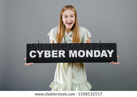 beautiful happy smiling woman with cyber monday sign isolated