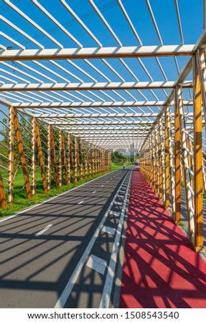 Latticed passage for cyclists and walkers in Maryino park, Moscow