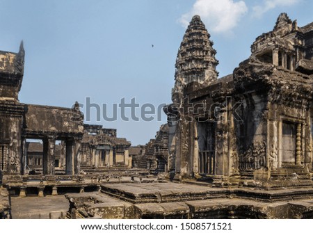 Amazing sunny day in Angkor Watt in Camboya. Incredible and historic temple with very old architecture. Culture and religion concept. 