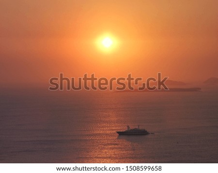 Zoom photo of sunrise over the Aegean blue sea with beautiful colours