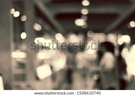 Blur image of people at market with bokeh for background usage.