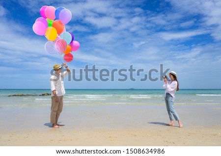couple lover enjoy taking picture togehter on the sea beach, holliday or vacation, special day, happy occasion on the beach together