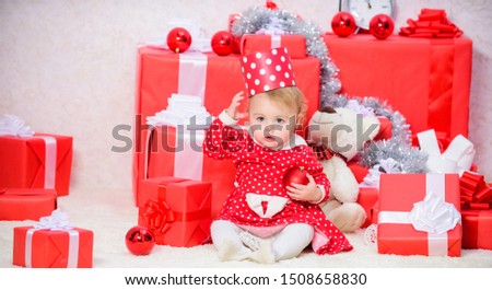 Family holiday. Christmas activities for toddlers. Christmas gifts for toddler. Things to do with toddlers at christmas. Gifts for child first christmas. Little baby girl play near pile of gift boxes.