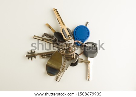 large bunch of different keys isolated on a white background
