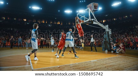 Basketball players on big professional arena during the game. Tense moment of the game. Celebration Royalty-Free Stock Photo #1508695742