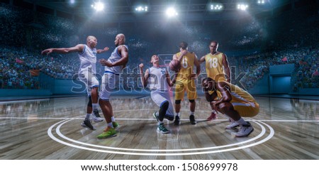Basketball players emotionally rejoice at victory on professional basketball stadium. Players from opposing teams are sad because of the defeat Royalty-Free Stock Photo #1508699978