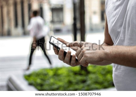 Unrecognized hands making call on mobile. Close up image of mans hands using modern technologies, checking smartphone while surfing net searching.  Man texting on his mobile. Technology concept.