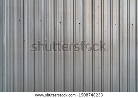 Pattern of old metal sheet roof texture. Rusty metal sheet texture. Aluminium Metal sheet roof for background or wallpaper. Silver white Corrugated metal texture surface.