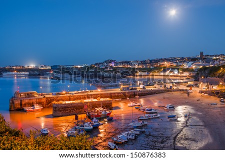 Full moon over the harbour and town at Newquay Cornwall England UK