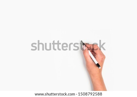 Female hands hold a pen. Isolated on white background. copy space, template.