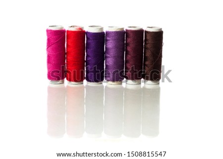 Variety color of sewing thread. Isolated pictured of sewing threads. Multi-color sewing thread. Spools of thread for sewing with white background.