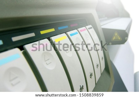 Large format printing machine with white lighting on white background. Hot dry ink printer system.