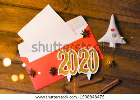 New Year and Christmas 2020 numbers on a wooden background