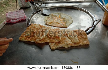 Roti is a type of food made from dough kneaded and then fried or grilled into thin strips. Eaten as a dessert Or eaten with other savory dishes. In Thailand, tend to be familiar with the roti