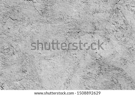 white and gray abstract textured plaster on the wall
