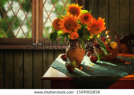 Rural still life with bouquet of sunflowers