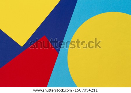 Texture background of fashion papers in memphis geometry style. Yellow, blue, light blue, red colors. Top view, flat lay