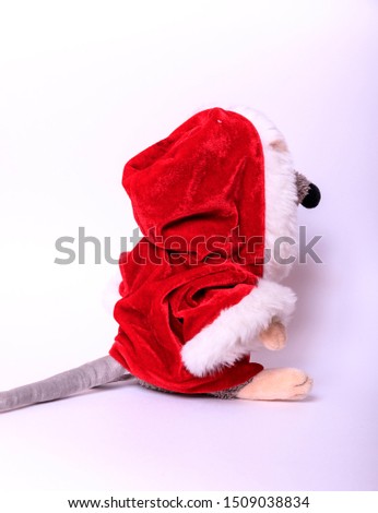 Christmas background. Xmas rat, mouse toy, symbol chinese happy new year 2020. Close up mouse toy in santa claus red hat and new year decorations. horoscope sign 2020. Copy space