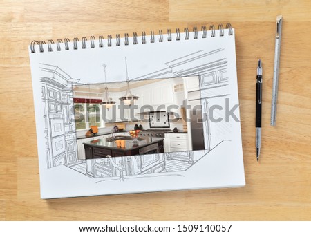 Sketch Pad on Desk with Drawing of Custom Kitchen and Square Section Showing Finished Construction Next To Engineering Pencil and Ruler Scale.