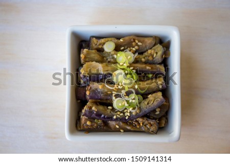 Korean food eggplant namul garnished with spring onion