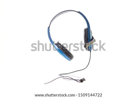 Isolated picture of blue color headphone. Headphones are a pair of small speakers for listening to sound from a computer, music or other electronic device. 