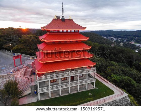 Early morning flight in Reading PA. The sunrising next to the pagoda looks amazing.