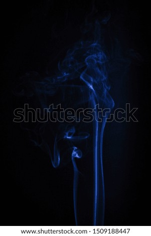 Smoke incense on a black or dark background closeup. Religion symbol concept