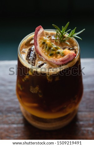 fusion drink menu. iced black coffee with passion fruit Royalty-Free Stock Photo #1509219491