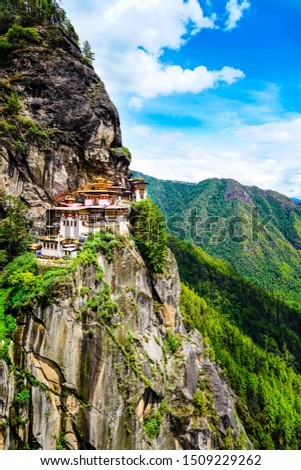 Paro Taktsang also known as the Tiger's Nest.Is a prominent Himalayan Buddhist sacred site and the temple complex is located in the cliffside of the upper Paro valley in Bhutan.Stock photo.