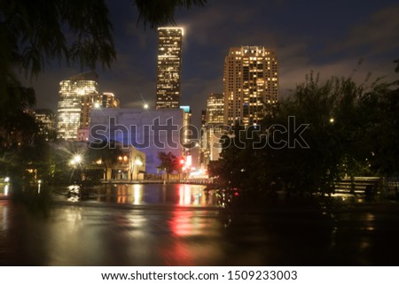 TROPICAL DEPRESSION IMELDA. Houston flood. Night city reflected in high water