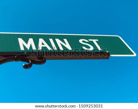 A ‘Main Street’ Street Sign Against the Sky.