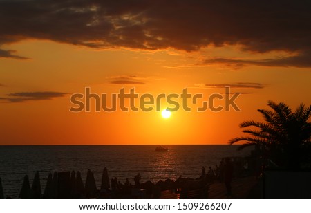 Beautiful bright sunset on the sea coast in autumn day. Template for calendar or cover tourism.