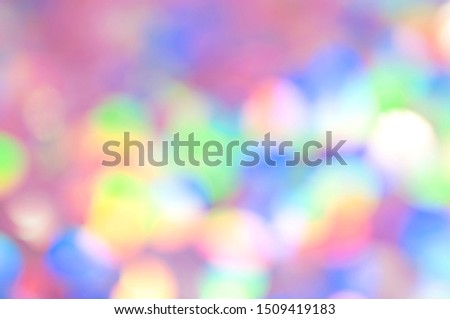 Rainbow colorful bokeh background. Christmas invitation or phone wallpaper.